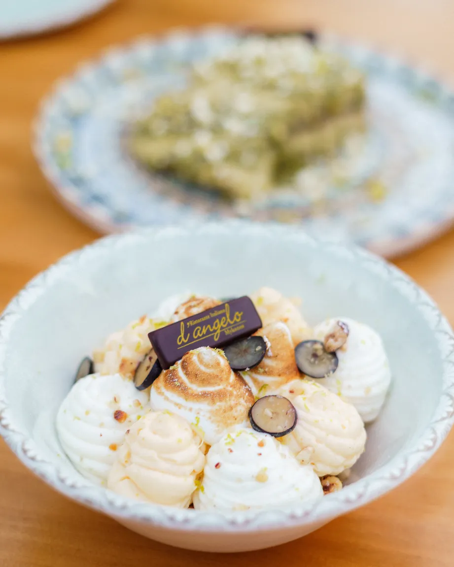 Dessert with meringue and d'angelo branded chocolate garnish